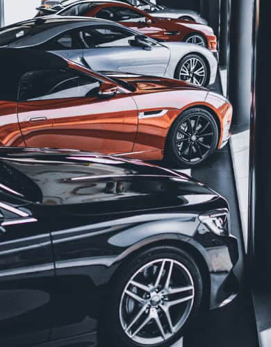 underside of a car being cleaned while its on a lift